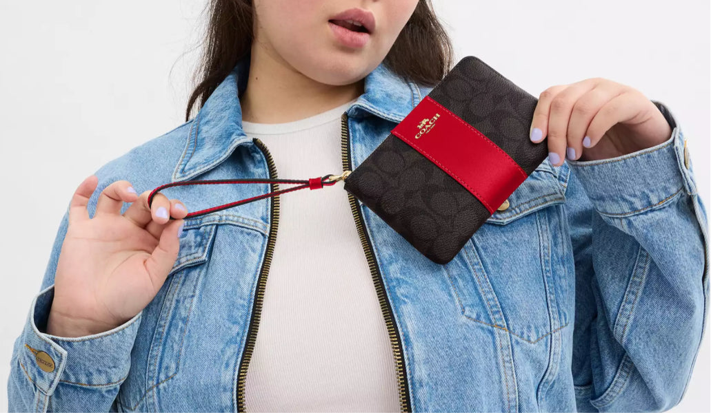 Coach Corner Zip Wristlet In Signature Canvas