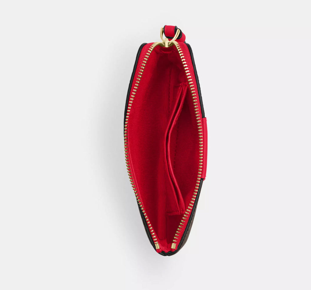 Coach Corner Zip Wristlet In Signature Canvas